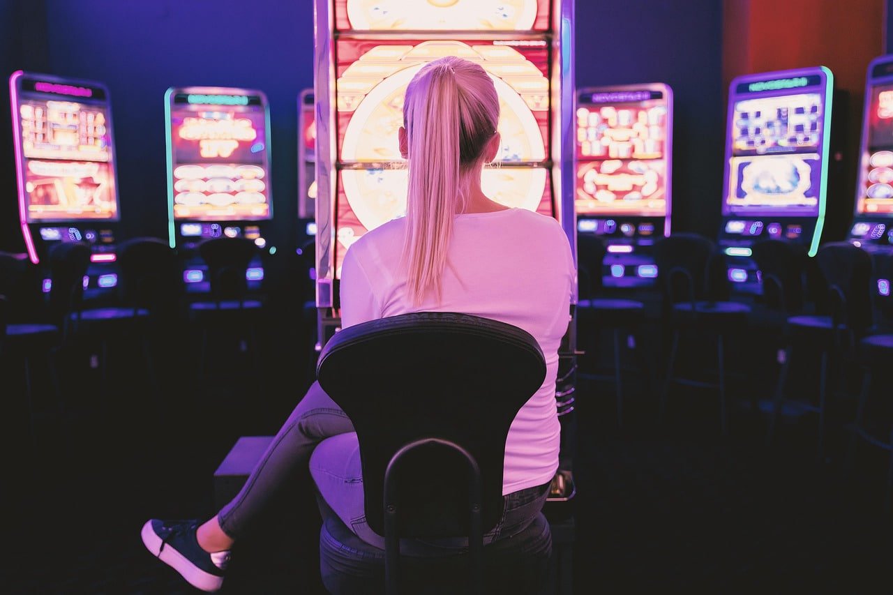 Players enjoying mobile sports betting and live casino games on gamezome